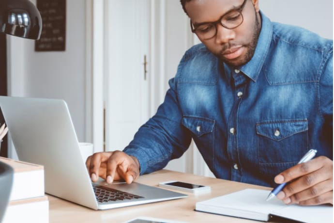 Young man working at home.